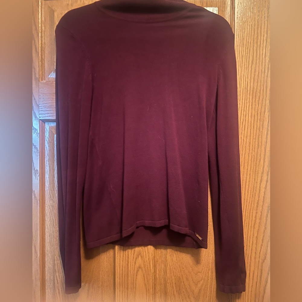 Red Turtle Neck with Long Sleeves. Size medium. Thick material.